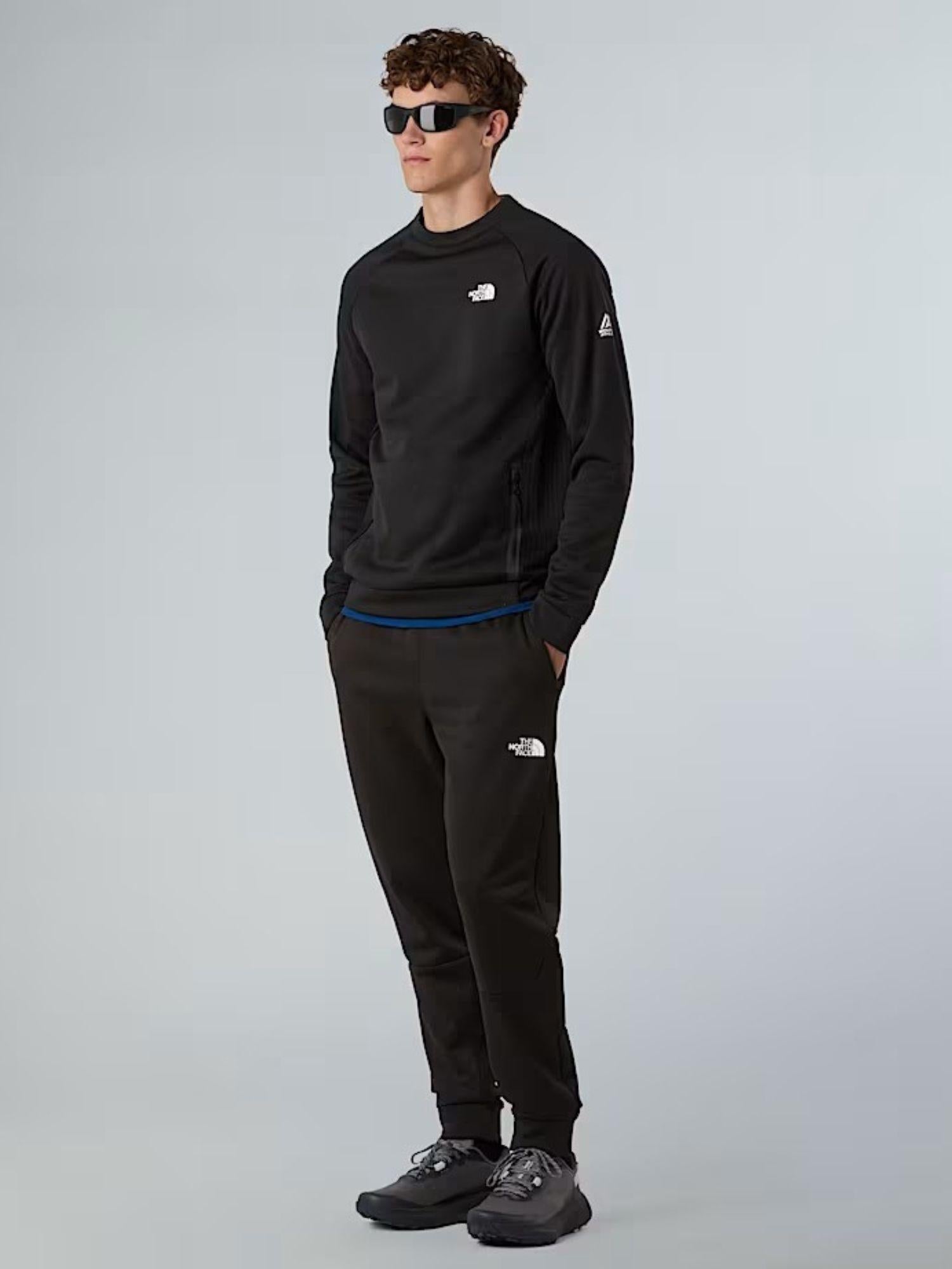 The North Face Joggers in pile Mountain Athletics Uomo TNF Black NF0A893S JK3 THE NORTH FACE 